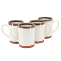 Set of five ceramic mugs with brown rim and base on a white background